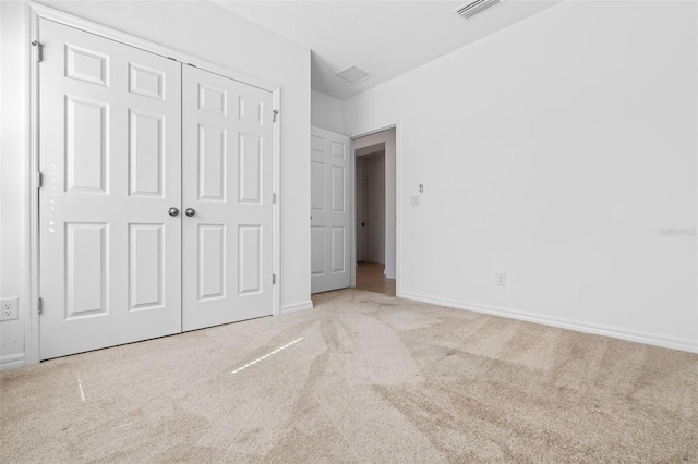 683 Campo Ln, Davenport, FL 33837 - unfurnished bedroom featuring a closet, carpet, baseboards, and visible vents