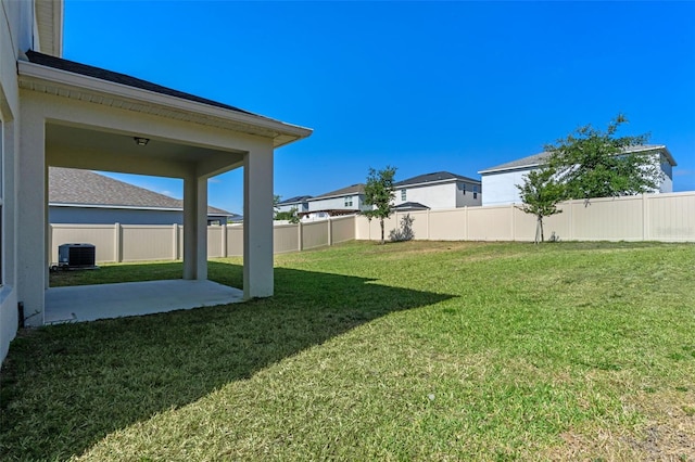 683 Campo Ln, Davenport, FL 33837 - view of yard featuring a fenced backyard, a patio, and central air condition unit