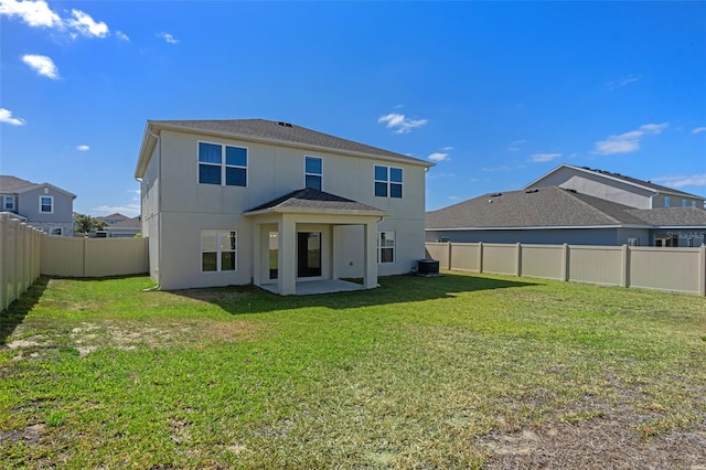 683 Campo Ln, Davenport, FL 33837 - rear view of house with a fenced backyard, stucco siding, and a lawn