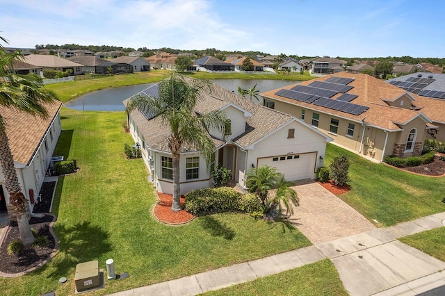 aerial view with a water view and a residential view
