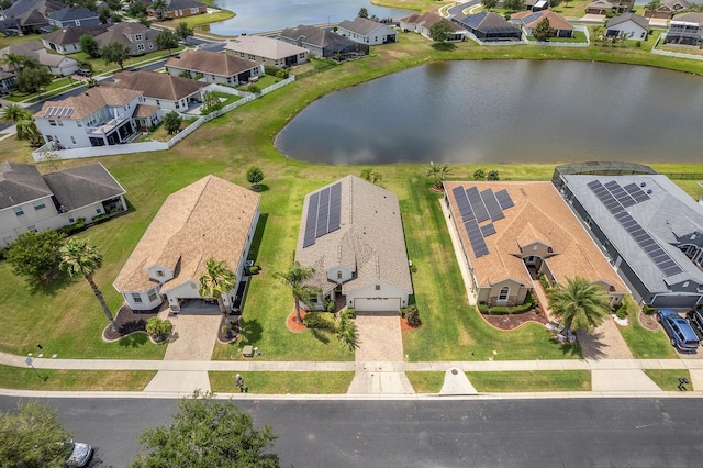bird's eye view with a residential view and a water view