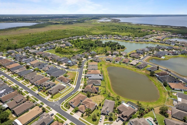 aerial view with a residential view and a water view