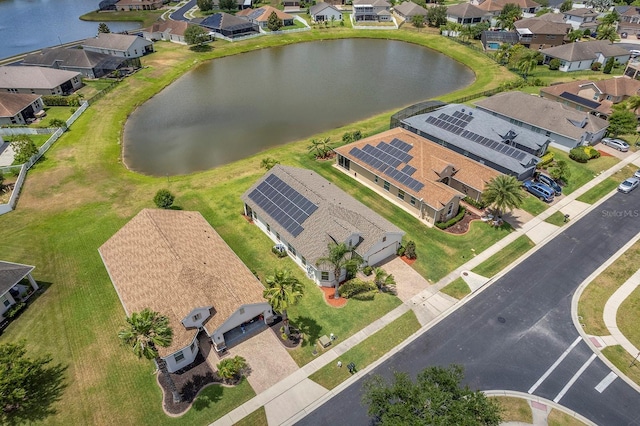 bird's eye view with a residential view and a water view
