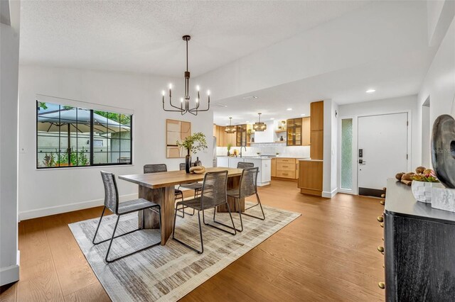1218 Fairway Dr, Winter Park, FL 32792 - dining space featuring a chandelier, light wood-type flooring, recessed lighting, and baseboards