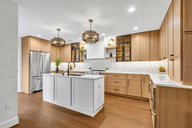 1218 Fairway Dr, Winter Park, FL 32792 - kitchen featuring high end fridge, a sink, light wood finished floors, decorative backsplash, and recessed lighting