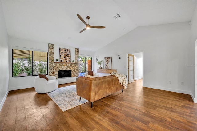 1218 Fairway Dr, Winter Park, FL 32792 - living room featuring a ceiling fan, vaulted ceiling, a fireplace, wood finished floors, and baseboards