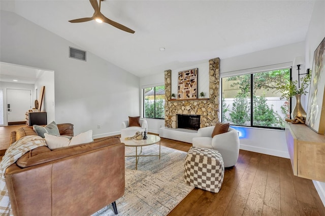 1218 Fairway Dr, Winter Park, FL 32792 - living area with hardwood / wood-style floors, a stone fireplace, a ceiling fan, baseboards, and high vaulted ceiling
