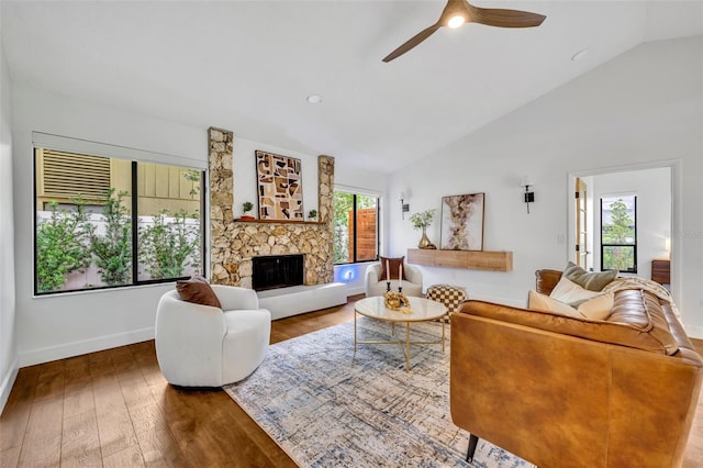 1218 Fairway Dr, Winter Park, FL 32792 - living area featuring a ceiling fan, wood-type flooring, a fireplace, baseboards, and high vaulted ceiling