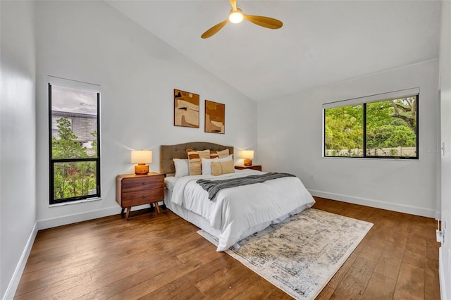 1218 Fairway Dr, Winter Park, FL 32792 - bedroom with hardwood / wood-style flooring, baseboards, high vaulted ceiling, and a ceiling fan