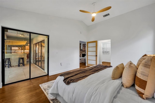 1218 Fairway Dr, Winter Park, FL 32792 - bedroom with access to exterior, wood finished floors, lofted ceiling, baseboards, and ceiling fan