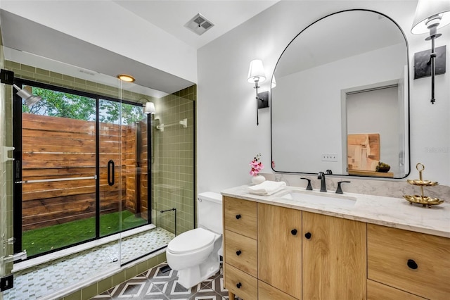 1218 Fairway Dr, Winter Park, FL 32792 - bathroom featuring a stall shower, toilet, and vanity