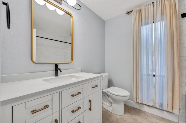 1218 Fairway Dr, Winter Park, FL 32792 - bathroom with toilet, vanity, and tile patterned floors