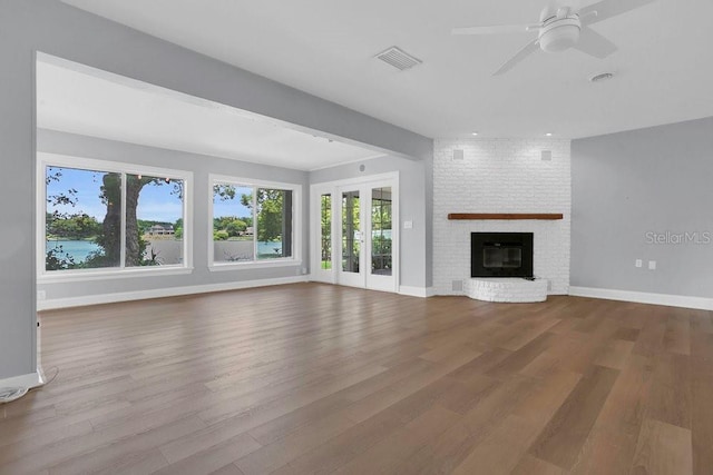 3605 Pershing Ave, Orlando, FL 32812 - unfurnished living room with wood finished floors, baseboards, and a ceiling fan