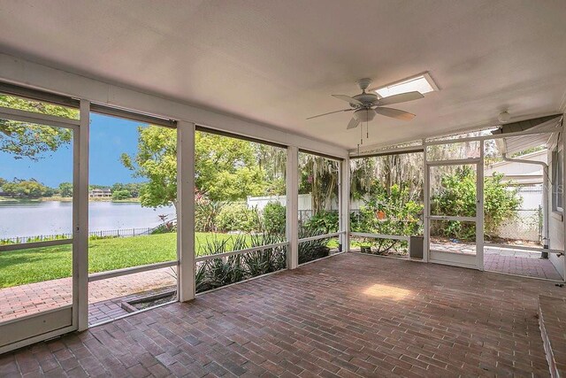 3605 Pershing Ave, Orlando, FL 32812 - unfurnished sunroom with a water view and a ceiling fan