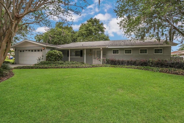3605 Pershing Ave, Orlando, FL 32812 - single story home with a garage and a front yard