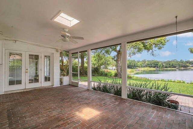 3605 Pershing Ave, Orlando, FL 32812 - unfurnished sunroom featuring french doors, a water view, healthy amount of natural light, and a skylight