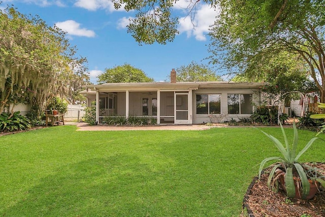 3605 Pershing Ave, Orlando, FL 32812 - back of property with a sunroom and a chimney