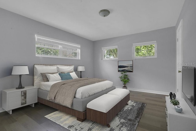 3605 Pershing Ave, Orlando, FL 32812 - bedroom with wood finished floors and baseboards