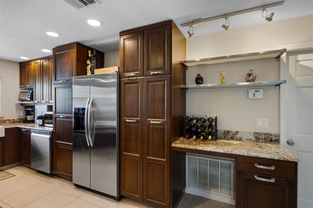 4118 Teriwood Ave, Orlando, FL 32812 - kitchen with visible vents, open shelves, appliances with stainless steel finishes, and light stone counters