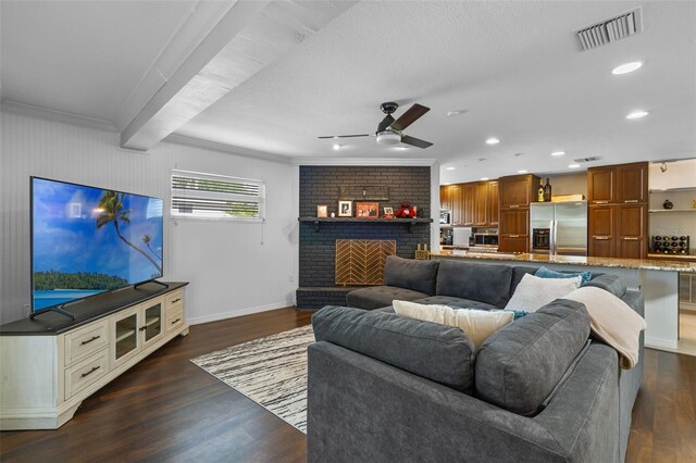 4118 Teriwood Ave, Orlando, FL 32812 - living area featuring a ceiling fan, visible vents, dark wood-style floors, and a fireplace