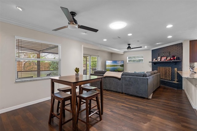 4118 Teriwood Ave, Orlando, FL 32812 - dining area with crown molding, a ceiling fan, a brick fireplace, and plenty of natural light