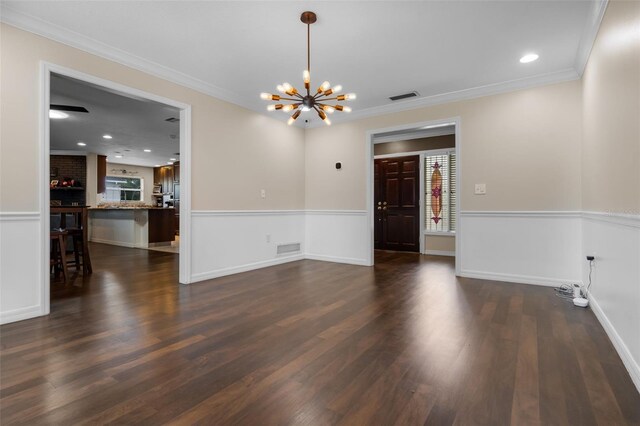 4118 Teriwood Ave, Orlando, FL 32812 - interior space with an inviting chandelier, wainscoting, dark wood-style floors, and visible vents