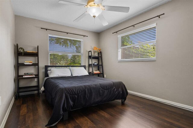 4118 Teriwood Ave, Orlando, FL 32812 - bedroom with baseboards, multiple windows, and wood finished floors