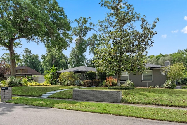 4118 Teriwood Ave, Orlando, FL 32812 - view of front facade featuring stucco siding and a front yard