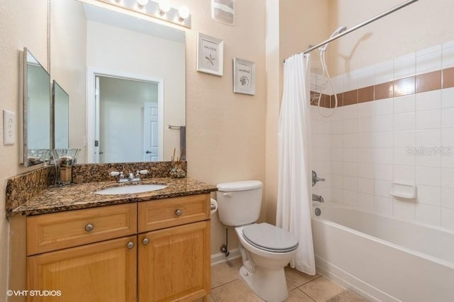 bathroom with vanity, tile patterned floors, shower / bath combo, and toilet