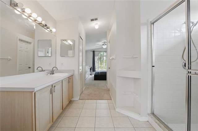 full bath with ceiling fan, visible vents, tile patterned flooring, a stall shower, and vanity