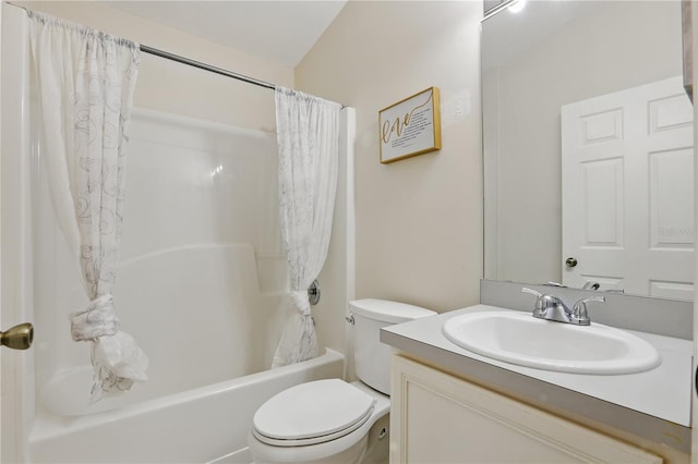 full bathroom with vanity, shower / bath combo with shower curtain, and toilet