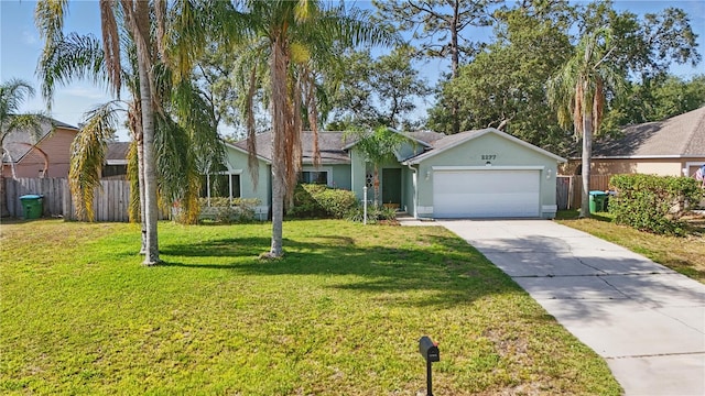single story home with fence, a garage, stucco siding, a front yard, and concrete driveway