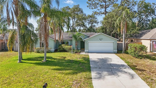 single story home with driveway, a front yard, fence, an attached garage, and stucco siding