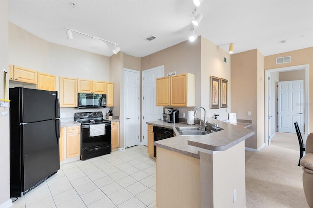 kitchen featuring black appliances, light brown cabinets, track lighting, and a peninsula