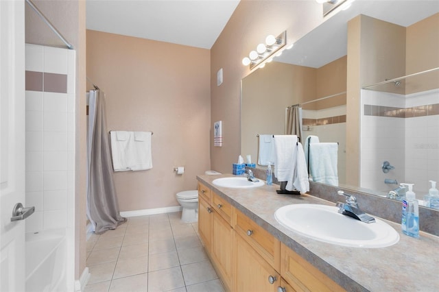 full bath featuring tile patterned flooring, toilet, baseboards, double vanity, and shower / bath combo