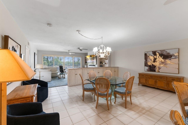 6330 Masters Blvd Unit N4, Orlando, FL 32819 - dining space featuring a chandelier, a ceiling fan, and light tile patterned floors