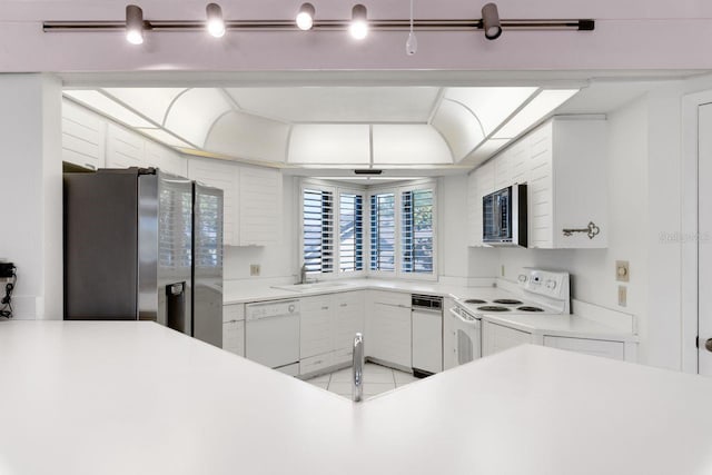 6330 Masters Blvd Unit N4, Orlando, FL 32819 - kitchen with white appliances, light countertops, and white cabinetry