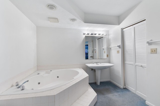 6330 Masters Blvd Unit N4, Orlando, FL 32819 - full bathroom with a closet and a tub with jets