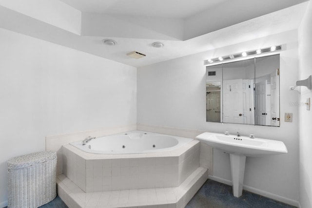 6330 Masters Blvd Unit N4, Orlando, FL 32819 - bathroom with a whirlpool tub and a sink