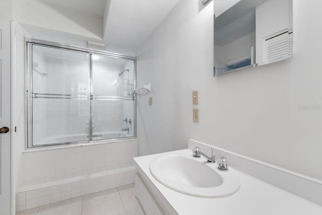 6330 Masters Blvd Unit N4, Orlando, FL 32819 - bathroom featuring tiled shower / bath, tile patterned floors, and vanity