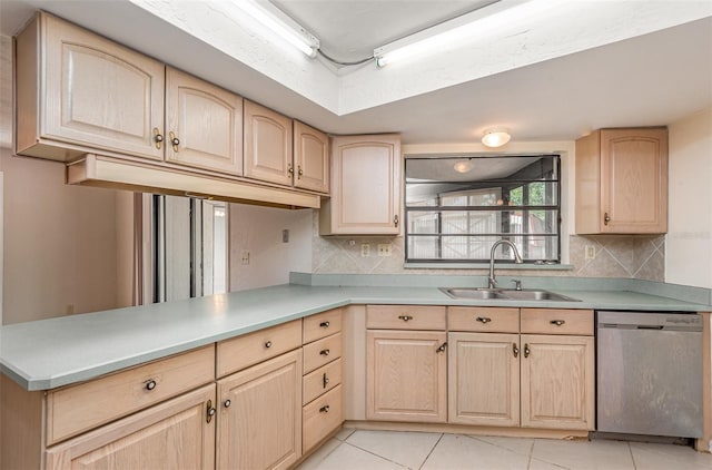 kitchen with light brown cabinetry, dishwasher, tasteful backsplash, a sink, and light tile patterned floors