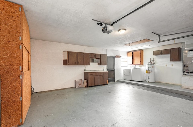 garage featuring separate washer and dryer, a garage door opener, heating unit, and electric water heater