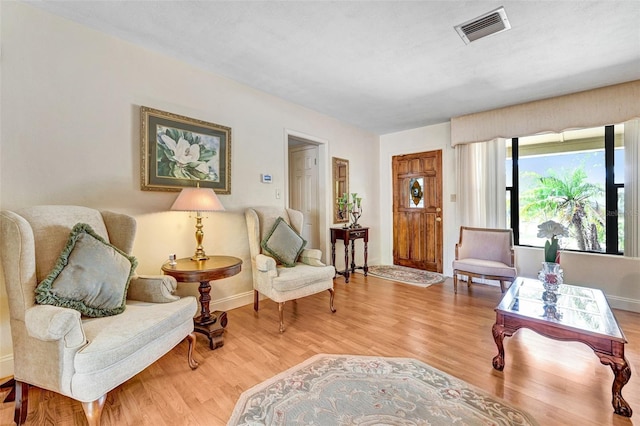 1208 Duke Way, Cocoa, FL 32922 - living area with light wood finished floors, visible vents, and baseboards