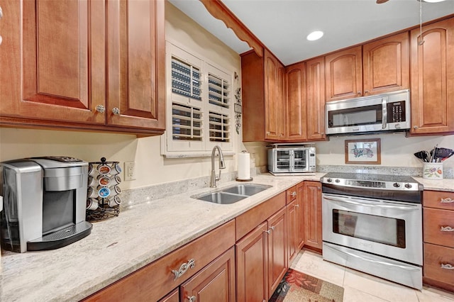 1208 Duke Way, Cocoa, FL 32922 - kitchen featuring stainless steel appliances, recessed lighting, brown cabinetry, and a sink