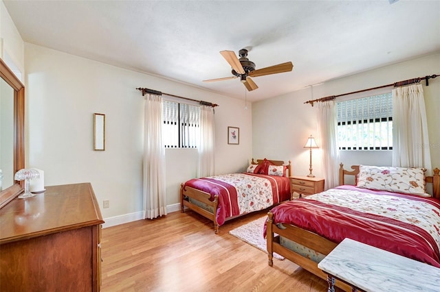 1208 Duke Way, Cocoa, FL 32922 - bedroom featuring a ceiling fan, light wood finished floors, and baseboards