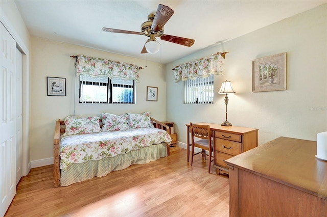 1208 Duke Way, Cocoa, FL 32922 - bedroom featuring a closet, ceiling fan, baseboards, and light wood-style floors