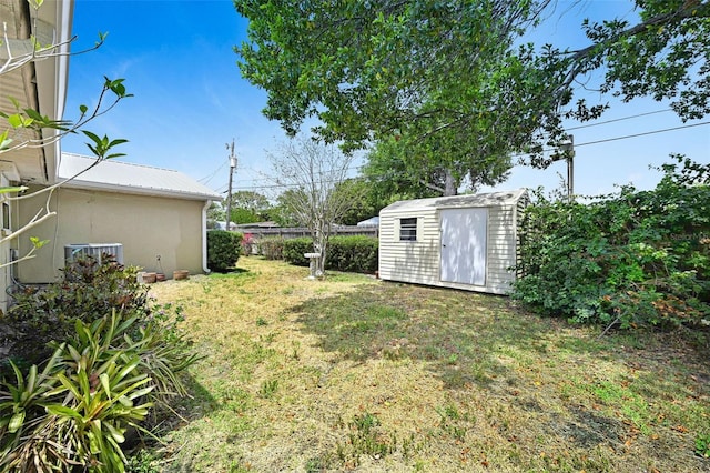 1208 Duke Way, Cocoa, FL 32922 - view of yard featuring an outbuilding, cooling unit, a storage unit, and fence