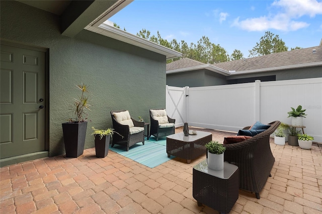 view of patio / terrace featuring fence and outdoor lounge area