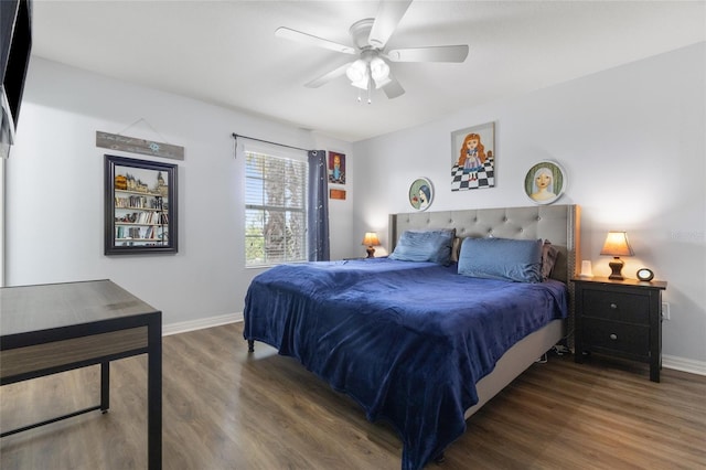 bedroom featuring baseboards, ceiling fan, and wood finished floors