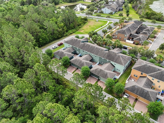 birds eye view of property featuring a residential view and a water view